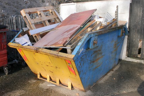 Construction site with a builders skip in Brixton